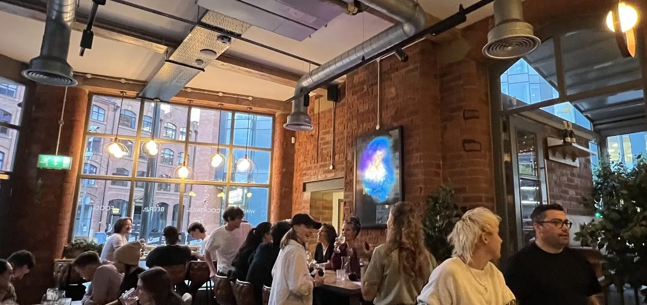 A full dining room in the evening